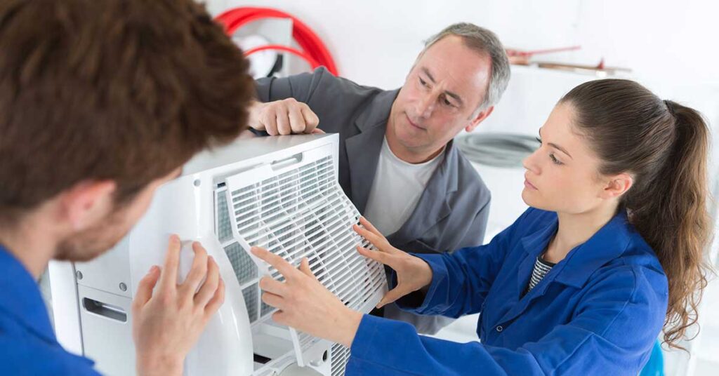 Repairman overseeing apprentices